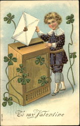 Boy putting valentine into big wooden mail box, clovers Postcard