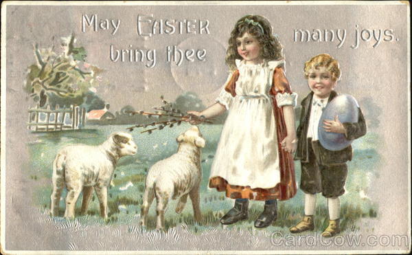 A boy and a girl look at 2 lamb With Children