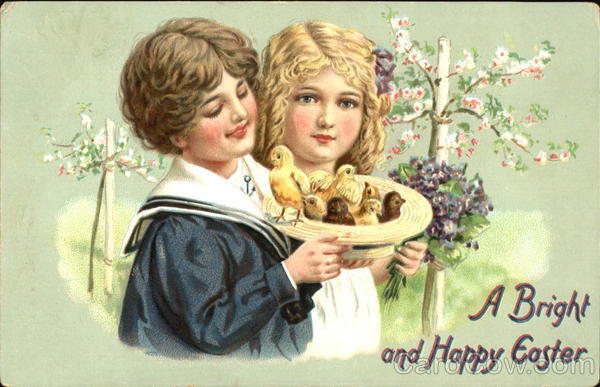 Two pretty children holding hat full of chicks With Children