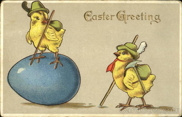 A couple of chicks with one standing on an egg With Chicks