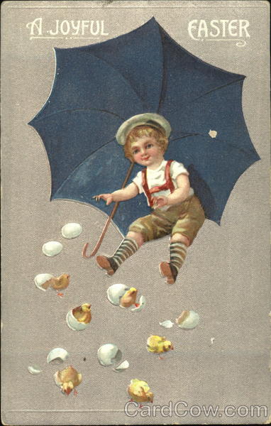 Boy under blue umbrella watching chicks hatch With Chicks