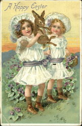Two pretty girls holding a bunny Postcard