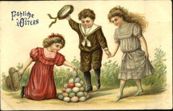 Three Children playing with Easter Eggs Postcard
