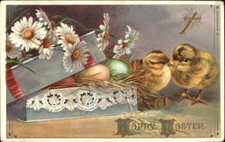 Two chicks next to a box with eggs and flowers Postcard