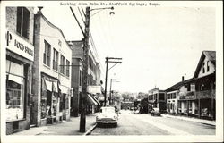 Looking down Main St Postcard