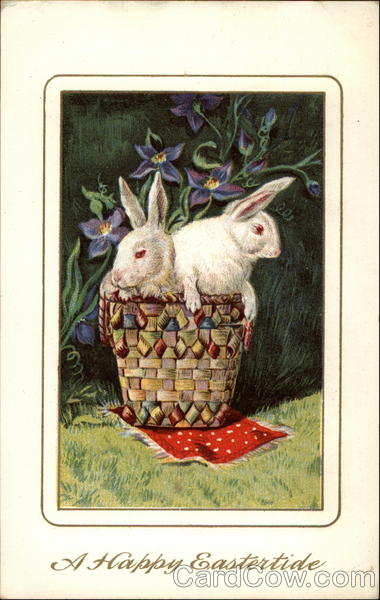 Two Bunnies in a basket With Bunnies