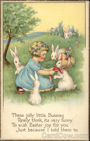 Little Girl Playing With Bunnies in a Meadow With Children