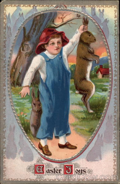 Boy in Overalls Holds Bunny Up by the Ears With Children