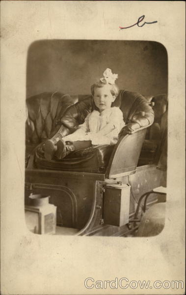 Little Girl Sitting in Leather Chair Girls