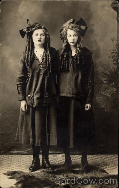 Two Girls Posed for a Portrait Women