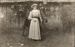 Woman at the turn of the century with a horse Postcard