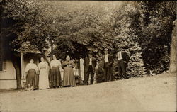 Family Portrait By Trees Outside House Family Portrait By Trees Outside House