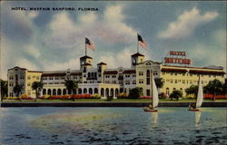 Hotel Mayfair, Sanford, FL, seen over water with sailboats Florida Postcard Postcard