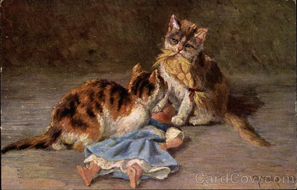 Two Cats Tearing Apart a Doll