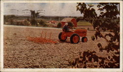 Farmer plowing a field on an Allis-Chalmers Model C tractor Postcard