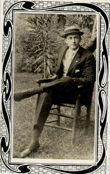 Man with cap sitting in chair Men