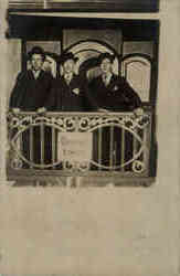 Three men on Back of Railroad Car Postcard