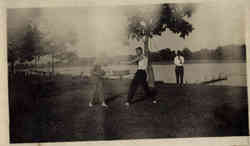 Boxing Match, two men boxing by lake Postcard