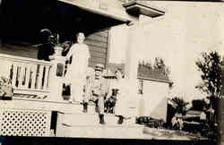 Family on porch with dog Postcard