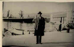 Businessman standing on Pier Postcard