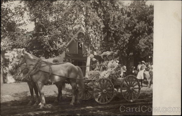 Women in a cart pulled by horses