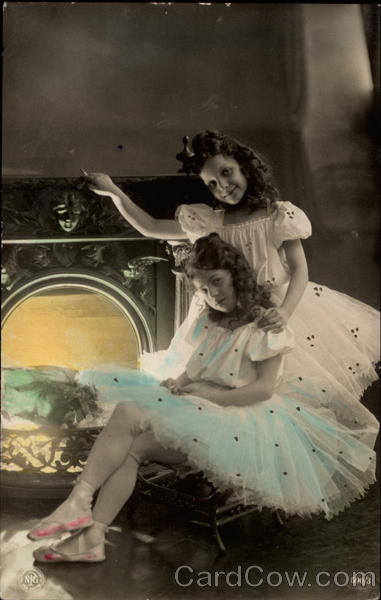 Two girls at fireplace