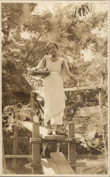 Native girl crossing on bridge Postcard