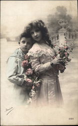 Boy and Girl Holding Flowers Postcard