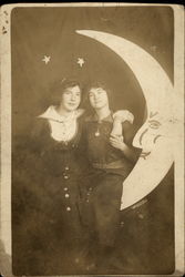 Female Affection - Women sitting on paper moon Postcard