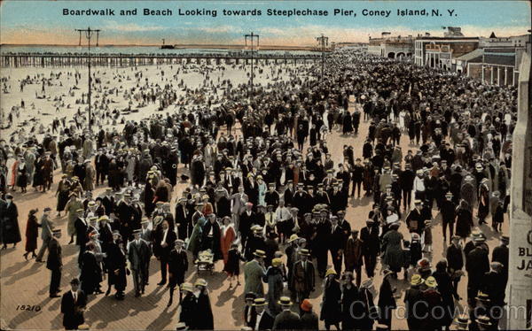 Boardwalk and beach looking towards Steeplechase Pier Coney Island New York
