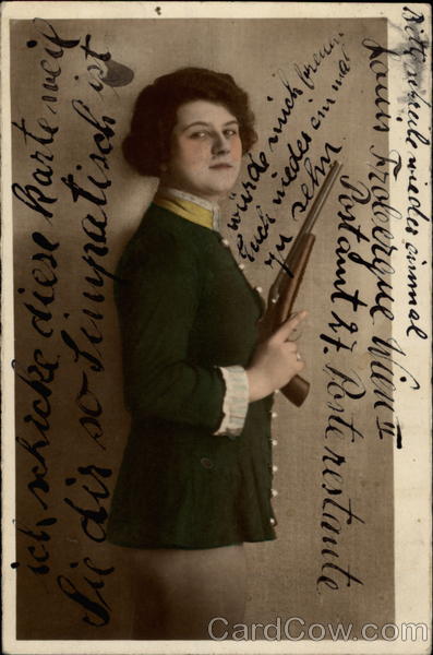 Portrait of woman holding gun Women
