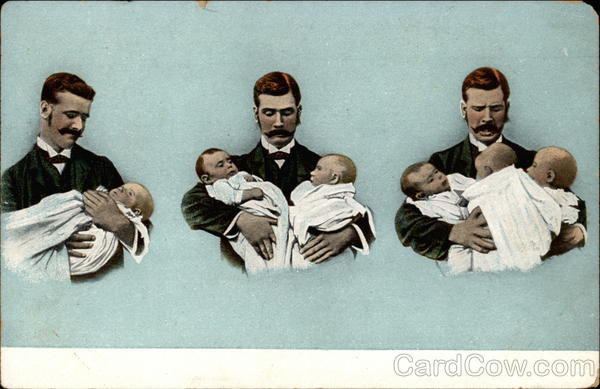 Three men holding babies