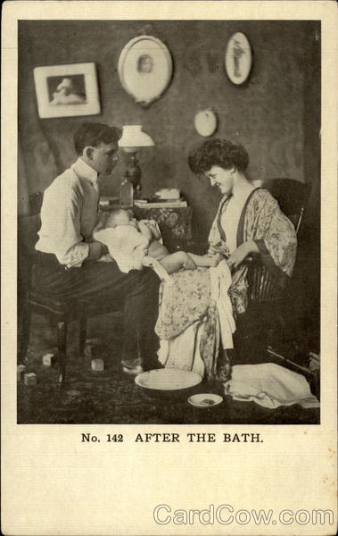 Parents with newborn after bath Children