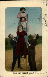 2 men holding 3 women up on ladder Postcard