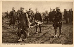 Soldiers taking injured off battlefield Postcard