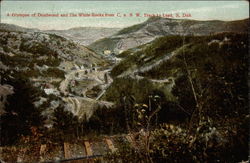 A Glympse of Deadwood and the White Rocks from C.u.N.W. Track to Lead Postcard