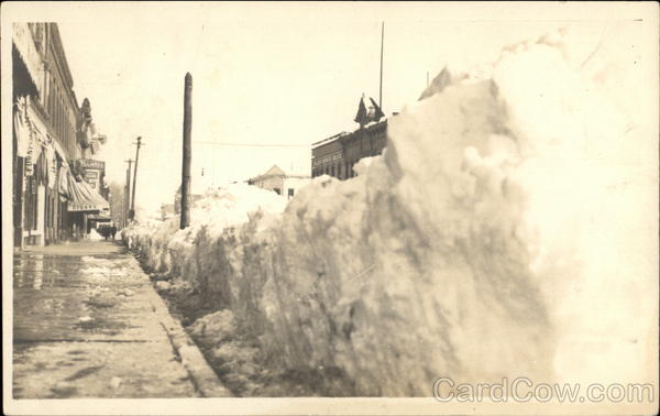 Snowbank lining sidewalk Boulder Colorado