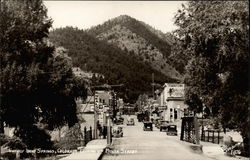 Looking up Main Street Idaho Springs, CO Postcard Postcard