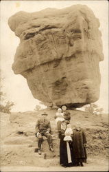 Family portrait in front of balancing rock Postcard