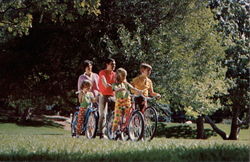 Family on Bike Ride Bicycles Postcard Postcard