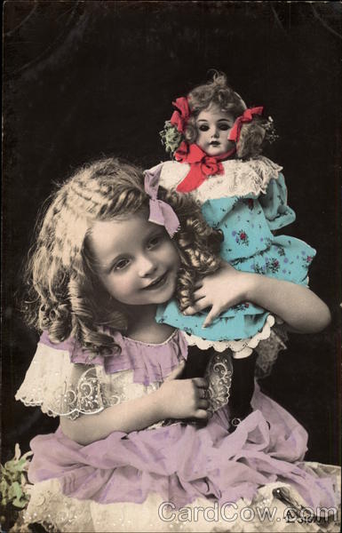 Young Girl Holding a Doll Girls