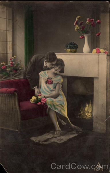 Couple Kissing by a Fireplace Couples