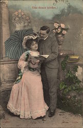 Couple Reading Outside Postcard