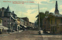 Main Street, Looking East , R. R. Station Postcard