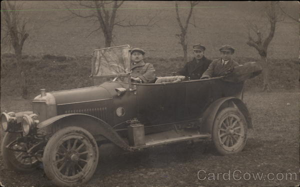 Three Men in an Early Automobile Cars