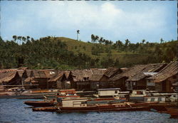 View of Old Port with Colorful Bancas and Nipa Huts Postcard
