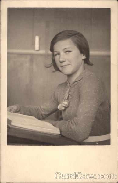 GIrl Sitting at Desk with a Book Girls