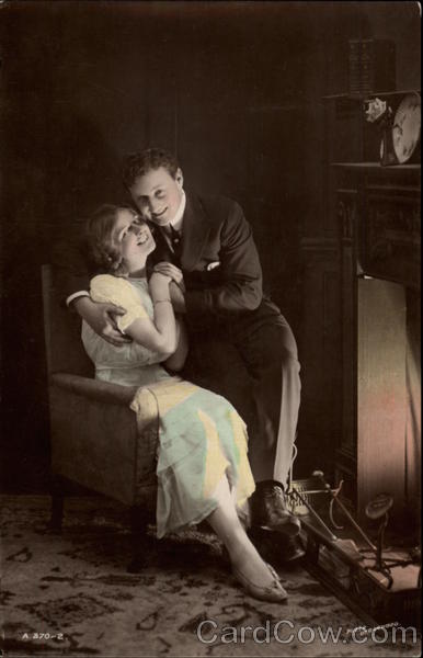 Couple in Chair Before Fire Romance & Love