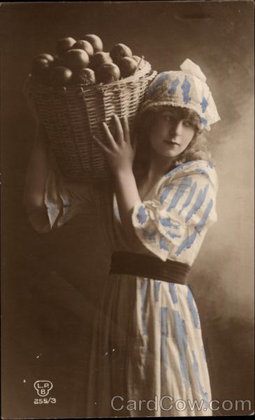 Young Woman Carrying Basket of Fruit Women