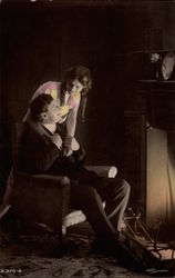 Husband and Wife in Front of Fire Postcard